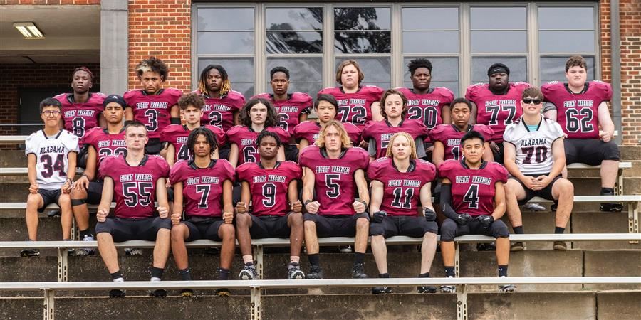 2023 ASD Silent Warrior football team stand side by side in two rows.